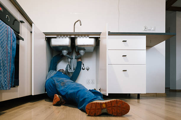 Professional Drain Cleaning technician working in Knoxville, IA